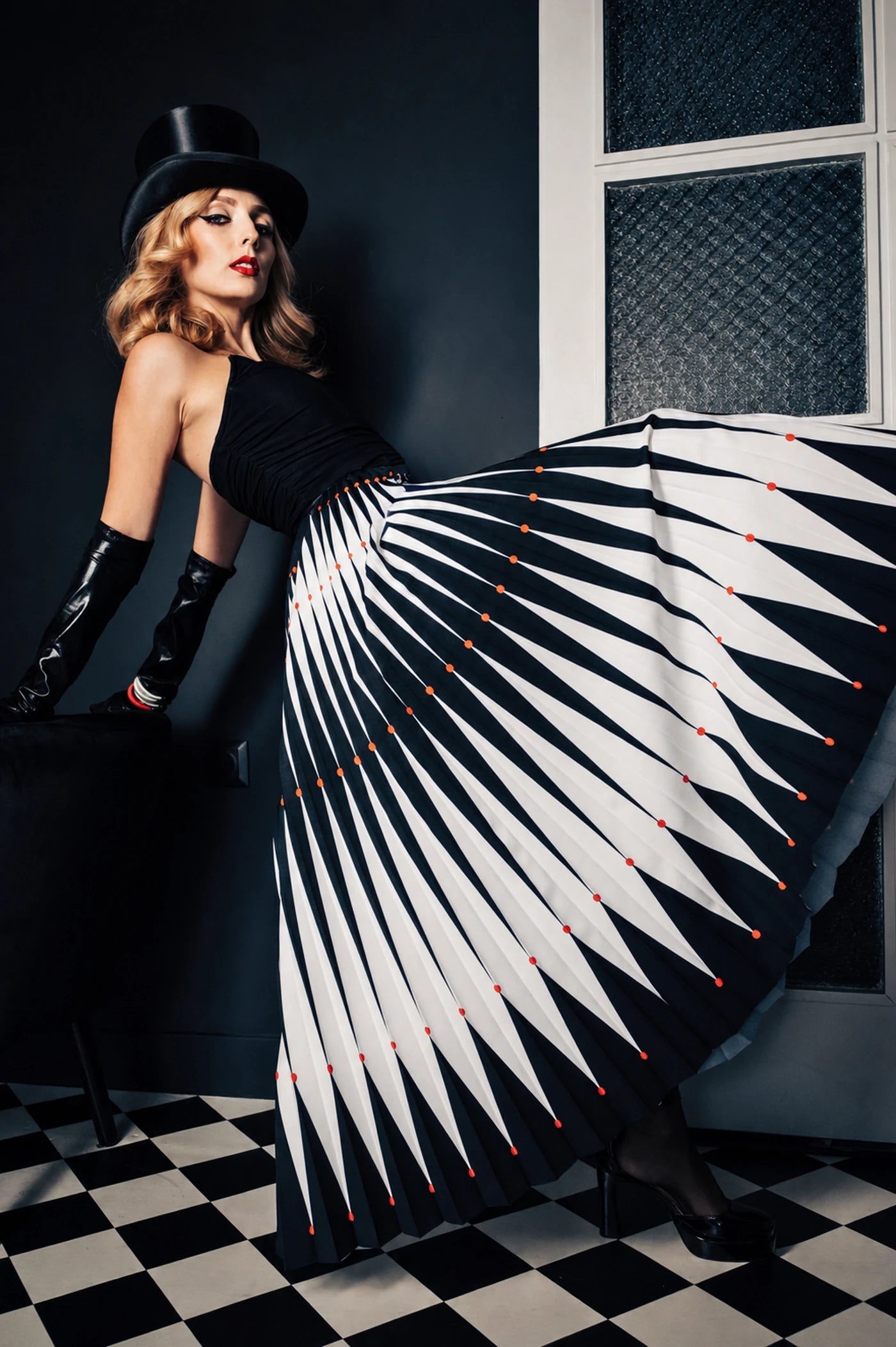 Harlequin pleated skirt in black, white and red