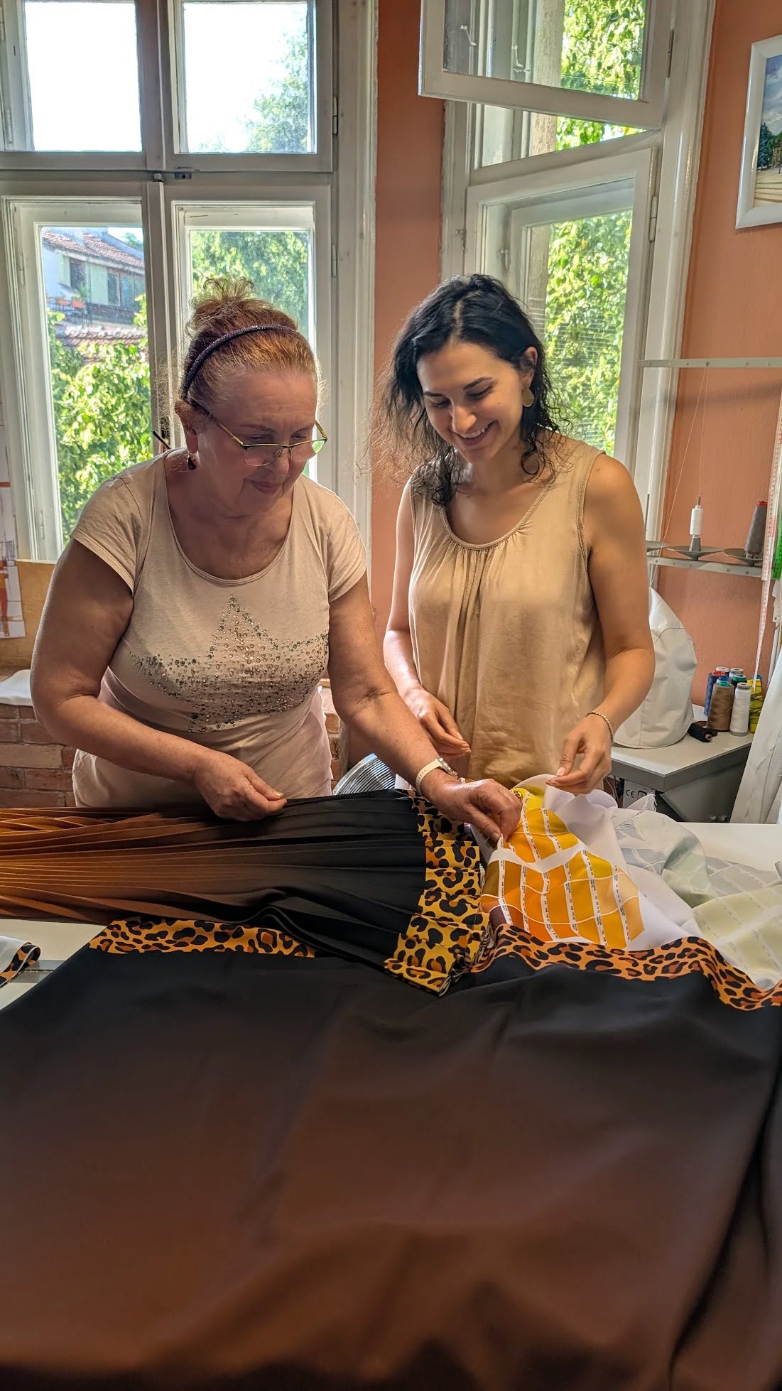Nadya and her mother working together on a Stylyne skirt in their Sofia atelier